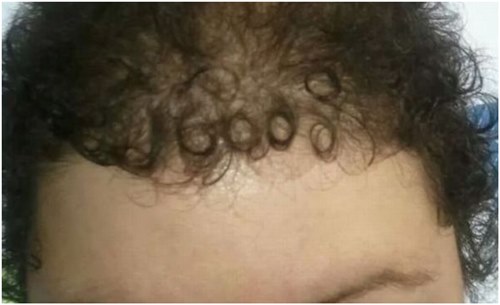 Tulisan “God” Muncul di Rambut
